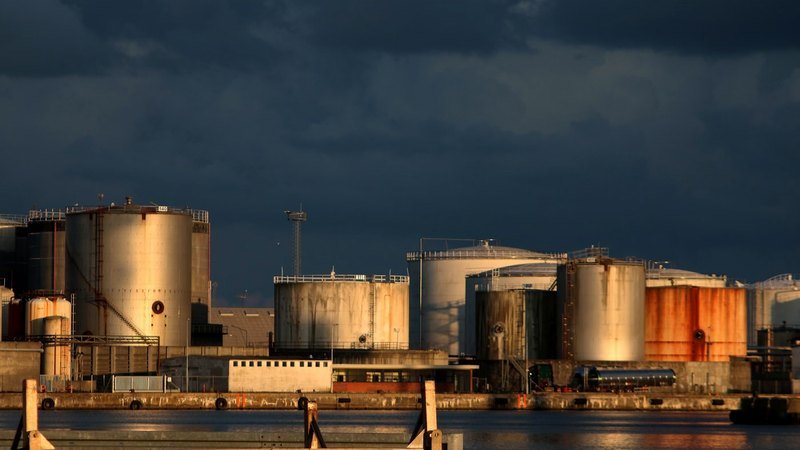 Petrochemical storage tank farm at dusk