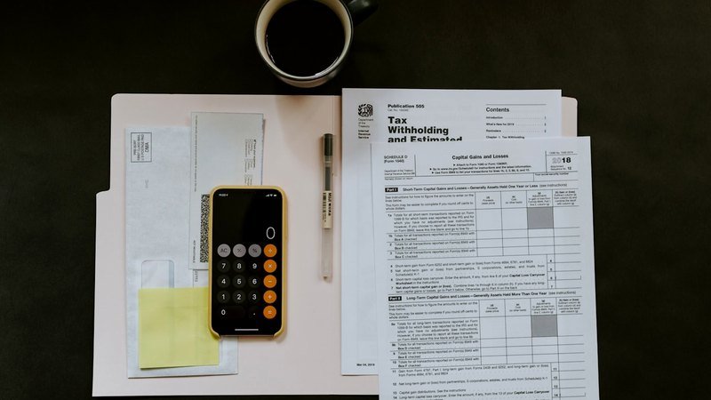 Tax return forms and a calculator