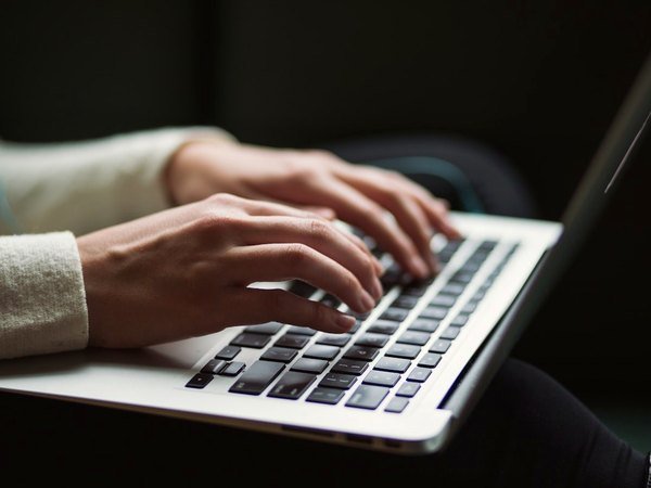 Sending a business enquiry on a laptop